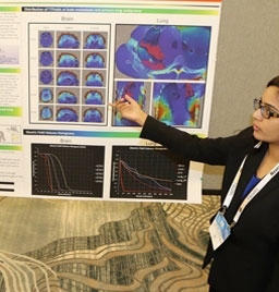 Woman pointing at brain scans